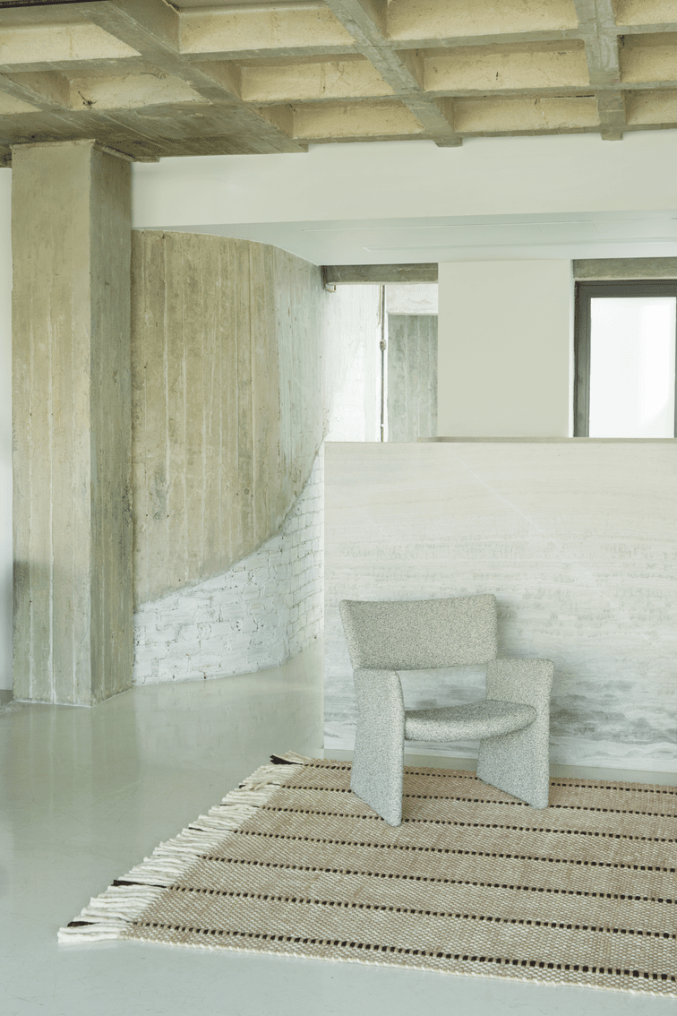 Black White Striped Wool Rug, Layered Cord, in a living room