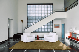 Khaki Wool Rug, Layered Solid Wool Green Umber, in a living room