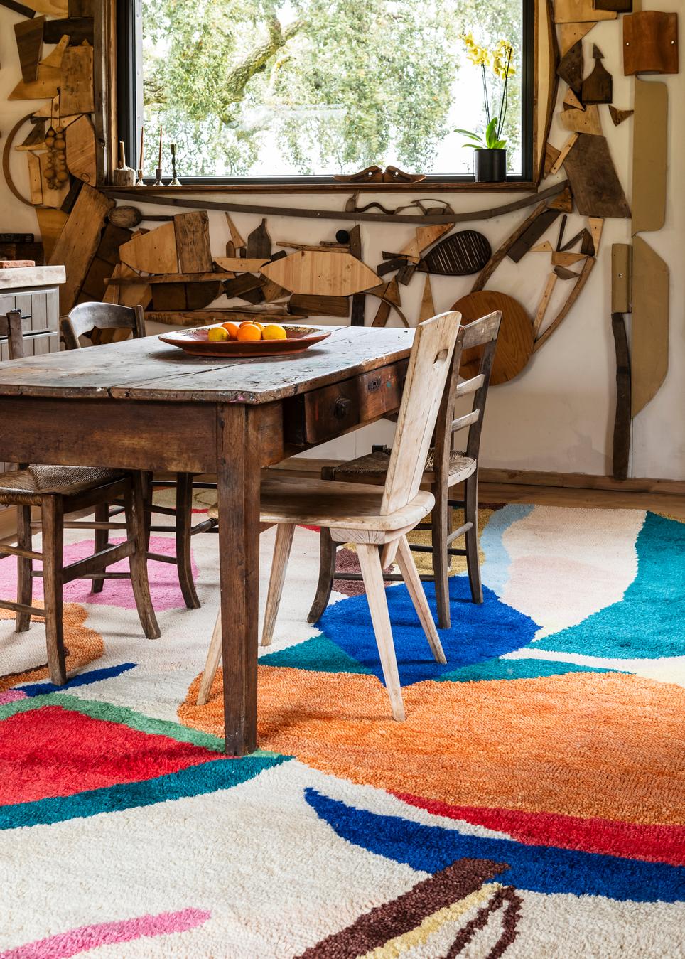Colourful Rug Kaleidoscope, Layered x Chontos, in a dining room