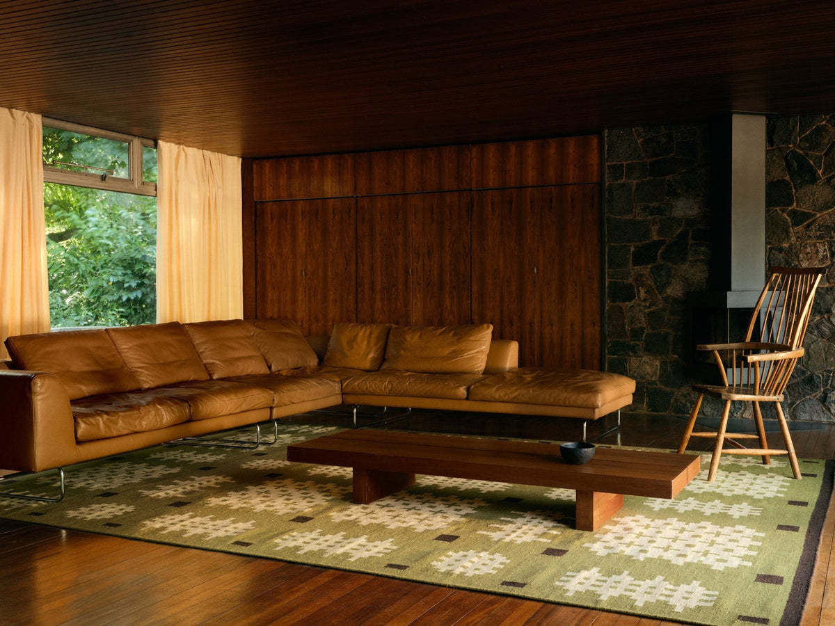 Green Welsh Rug, Layered x Tom Morris Bardsey, in a living room