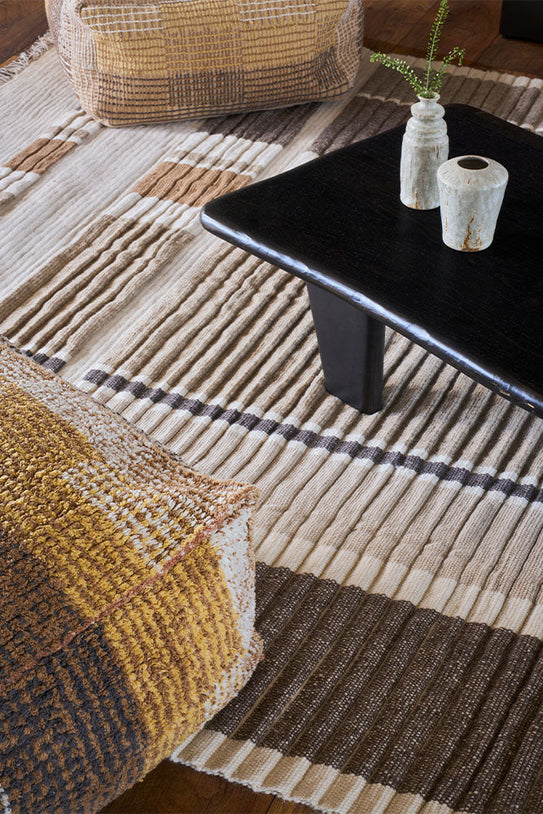 Lorena Canals Columns Natural Wool Rug, in a living room