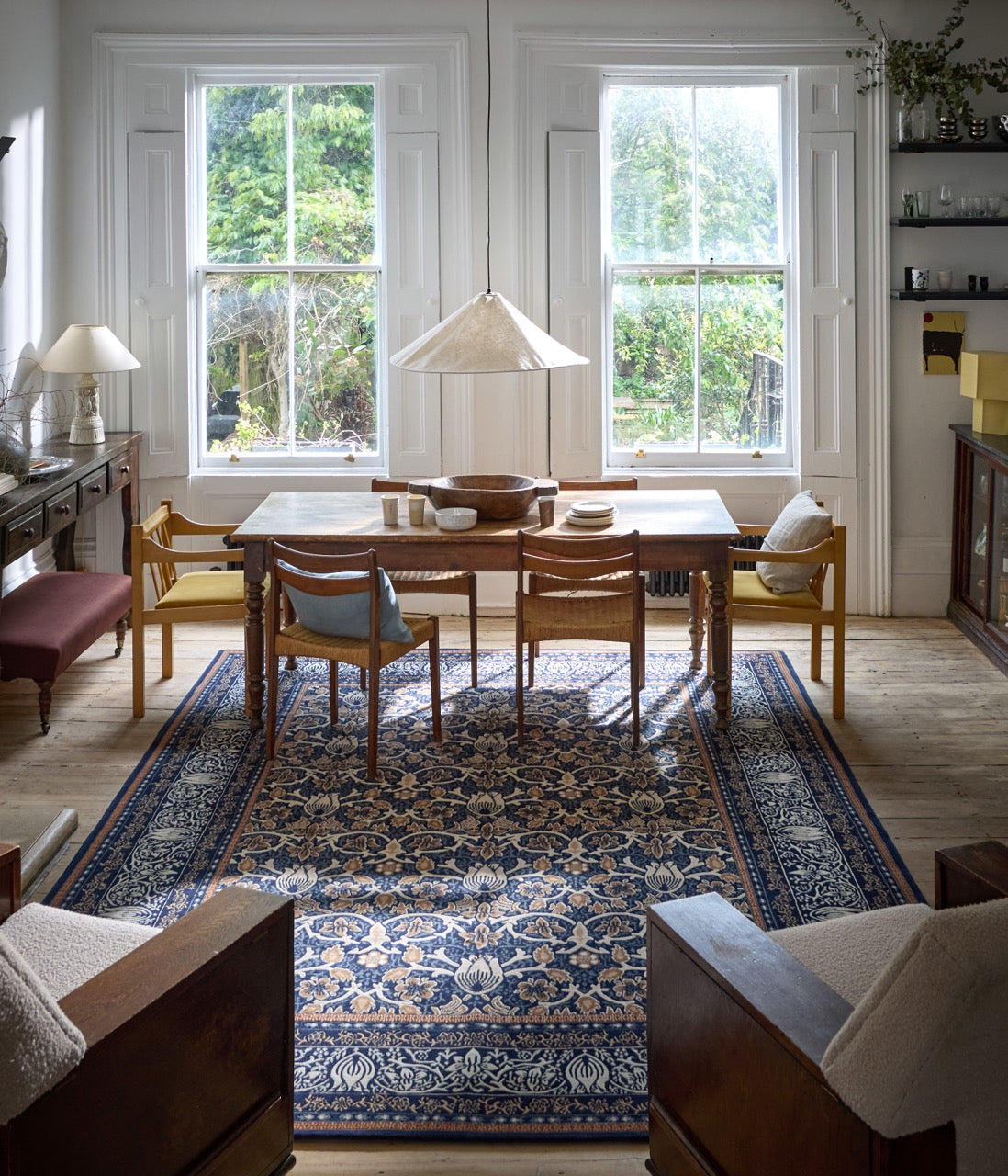 Morris & Co Borage Blue rug in indigo, ivory and caramel, shown in an interior