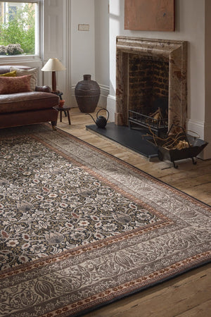 Morris & Co Borage Grey rug in stone grey, ivory and ochre, shown in an interior, second view