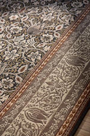 Morris & Co Borage Grey rug in stone grey, ivory and ochre, shown in an interior, third view