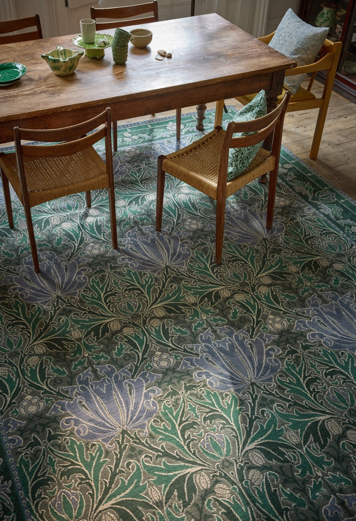 Morris & Co Helena Mineral rug in sea green and lavender blue, shown in an interior, second view