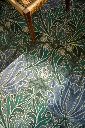 Morris & Co Helena Mineral rug in sea green and lavender blue, shown in an interior, third view