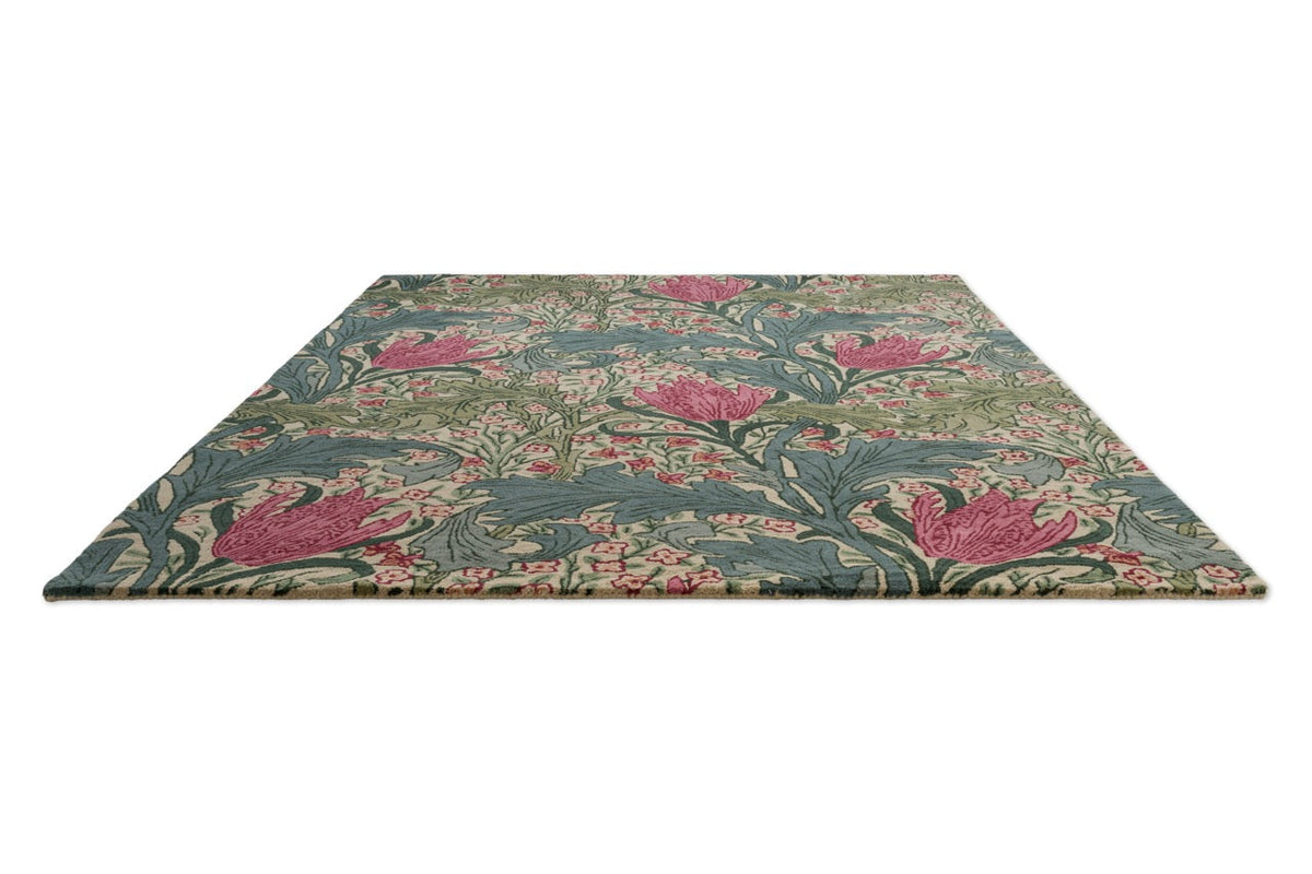 Morris & Co Lent Lily Plum Bayleaf rug in cream with plum tulips and bay green leaves, perspective view