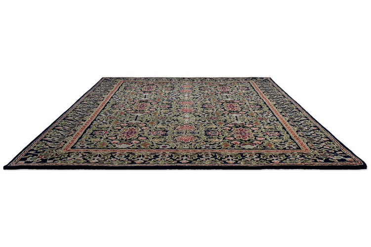 Morris & Co Wilton Weave Indigo rug in indigo, olive green and rose, perspective view