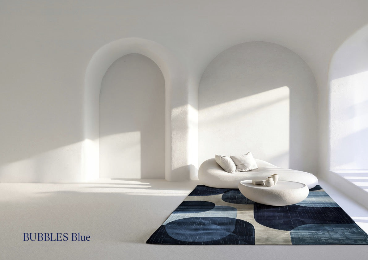 Acsento Bubbles Blue rug in blue with rounded shapes in petrol and navy on ivory, shown in an interior