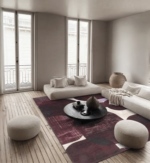 Acsento Bubbles Burgundy rug in burgundy with rounded shapes in wine red and aubergine on ivory, shown in an interior