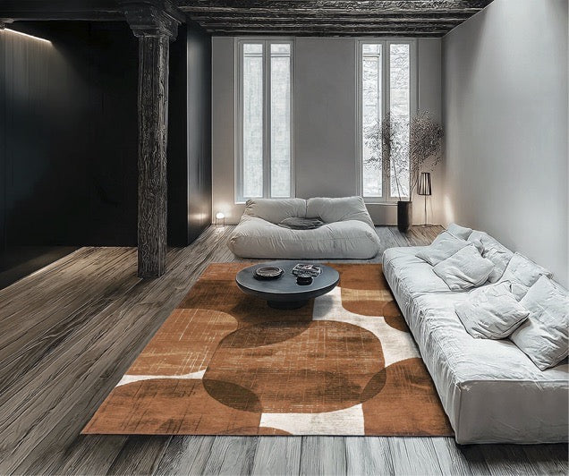 Acsento Bubbles Cognac rug in cognac with rounded shapes in burnt orange and caramel on cream, shown in an interior
