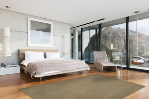 Acsento Caligari Taupe rug styled in a contemporary living room with neutral furnishings and natural accents.


