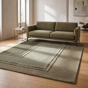 Acsento Delos Green rug in olive, sage and khaki with raised borders, shown in an interior