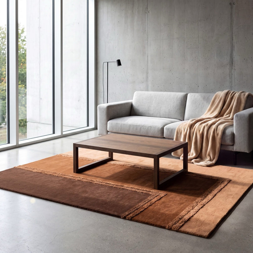 Acsento Delos Rust rug in rust, terracotta and chocolate brown with raised borders, shown in an interior, second view