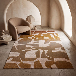 Acsento Duna Multi rug in ochre, rust and taupe collage shapes on cream, shown in an interior