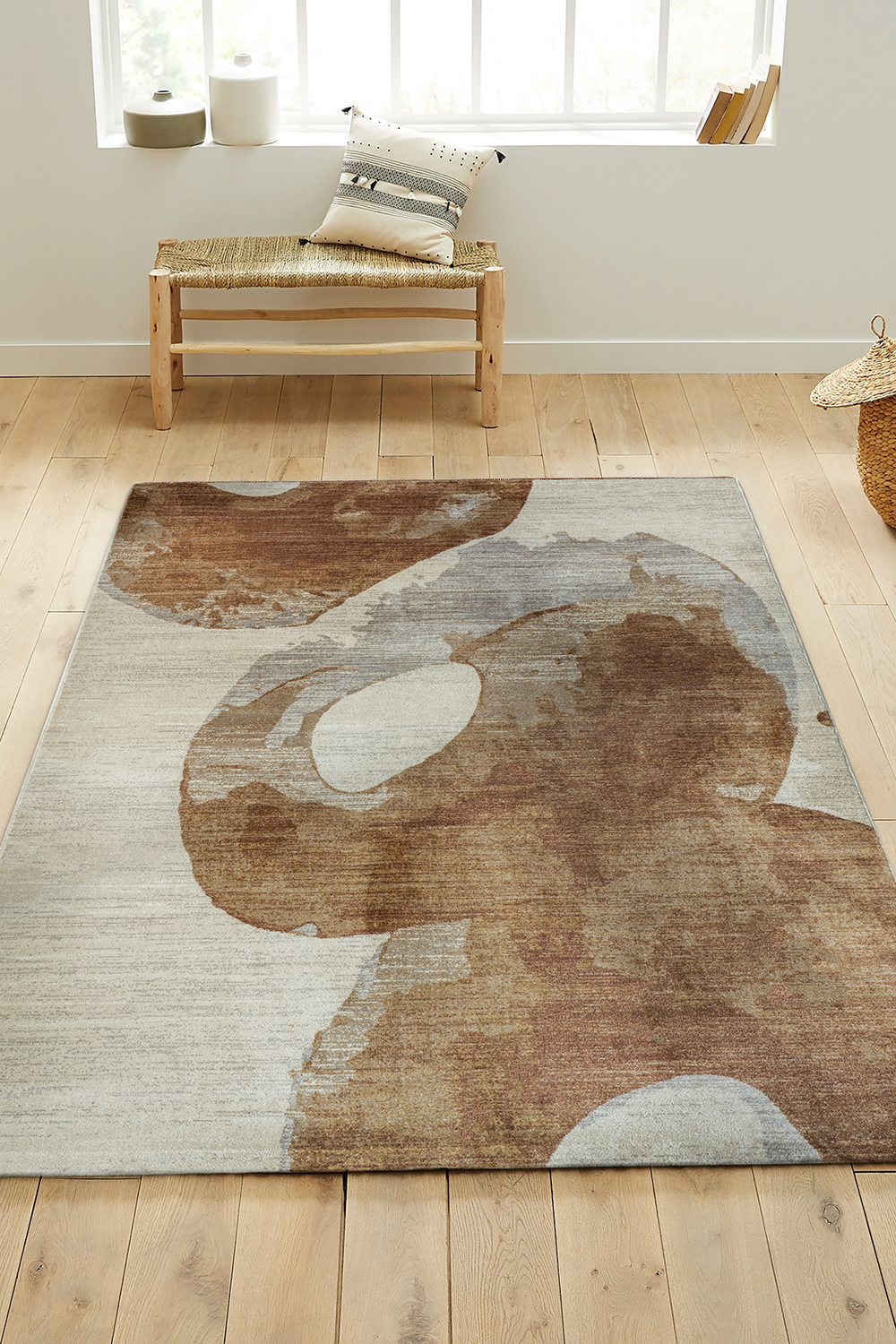 Ascento Fuji rug styled in a minimalist living room with warm oak and soft linen tones
