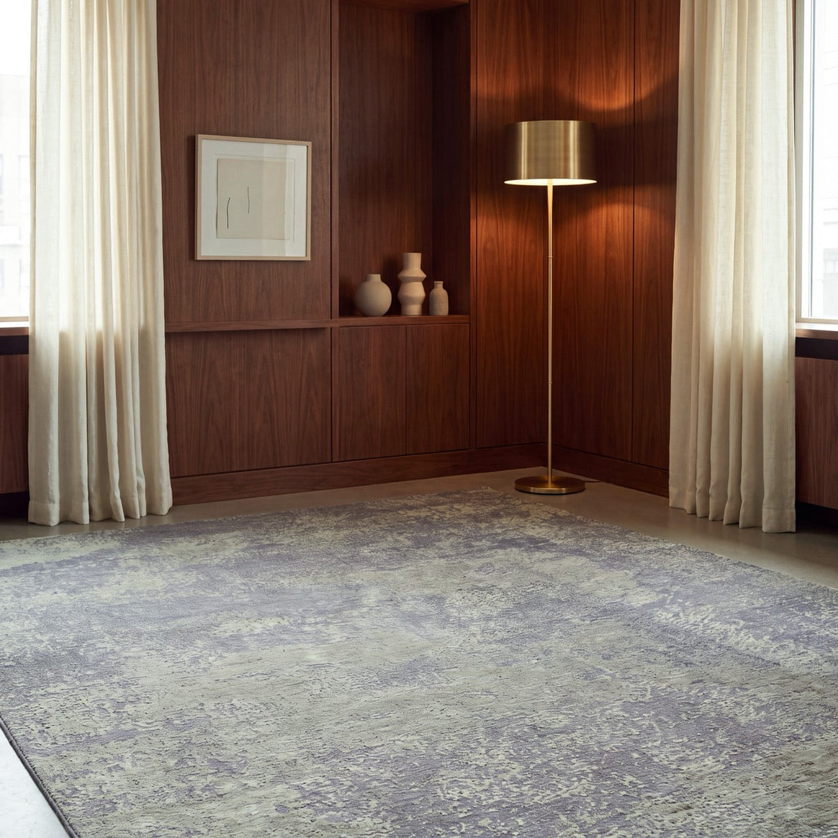 Acsento Laguna Green rug in moss green on charcoal grey, shown in an interior