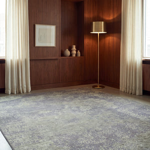 Acsento Laguna Green rug in moss green on charcoal grey, shown in an interior