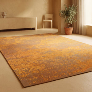 Acsento Laguna Melon rug in saffron and melon orange on caramel, shown in an interior