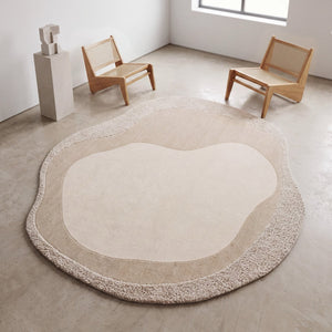 Acsento Malmö rug in ivory and beige with an organic shape, shown in an interior