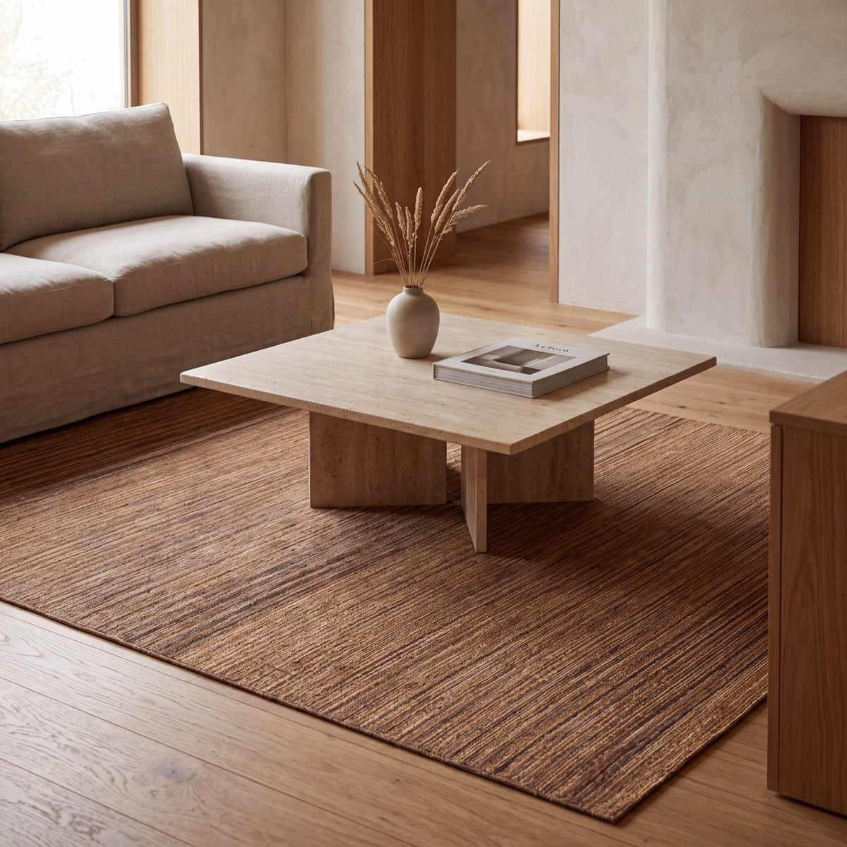 Acsento Origin Brown rug in brown with cognac and caramel stripes, shown in an interior
