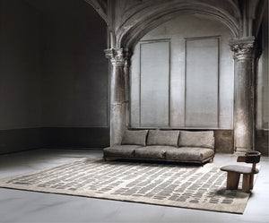 Acsento Papyrus Silver rug in light grey with rows of pewter grey brush marks, shown in an interior