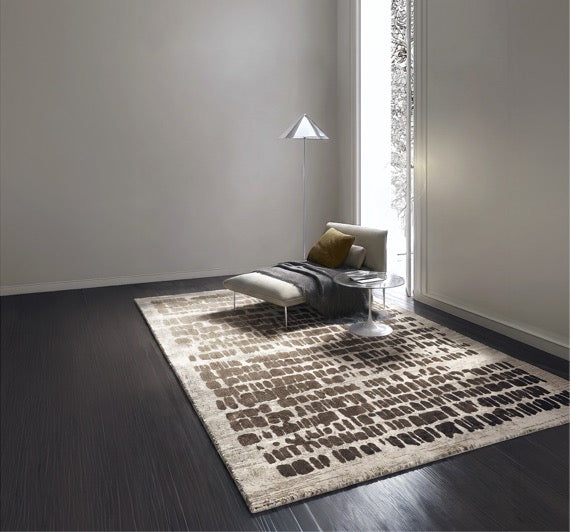 Acsento Papyrus Beige rug in beige with rows of brown brush marks, shown in an interior