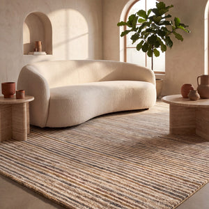 Acsento Siena 51 rug in beige with fine stripes in sand, caramel and ochre, shown in an interior, second view