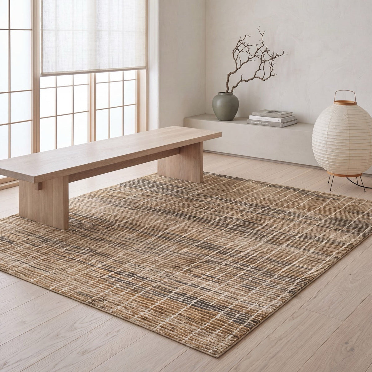 Acsento Siena 68 rug in beige with a soft check in sand, ochre and charcoal, shown in an interior