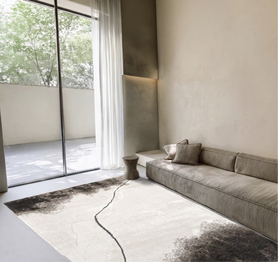 Acsento Valley rug in ivory with charcoal clouds and a fine dark line, shown in an interior
