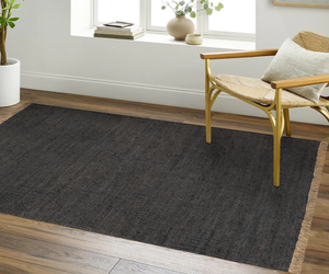 Acsento Vigo Charcoal rug styled in a modern living room with soft neutrals and wood finishes

