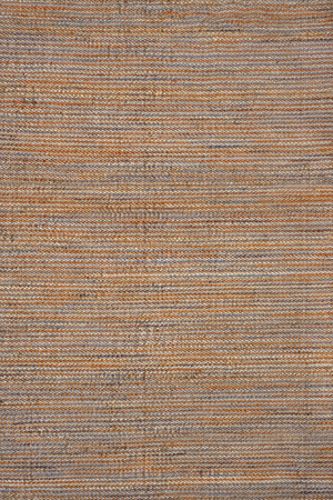 Top-down view of Acsento Bilbao Terra rug displaying full surface in solid terracotta jute weave

