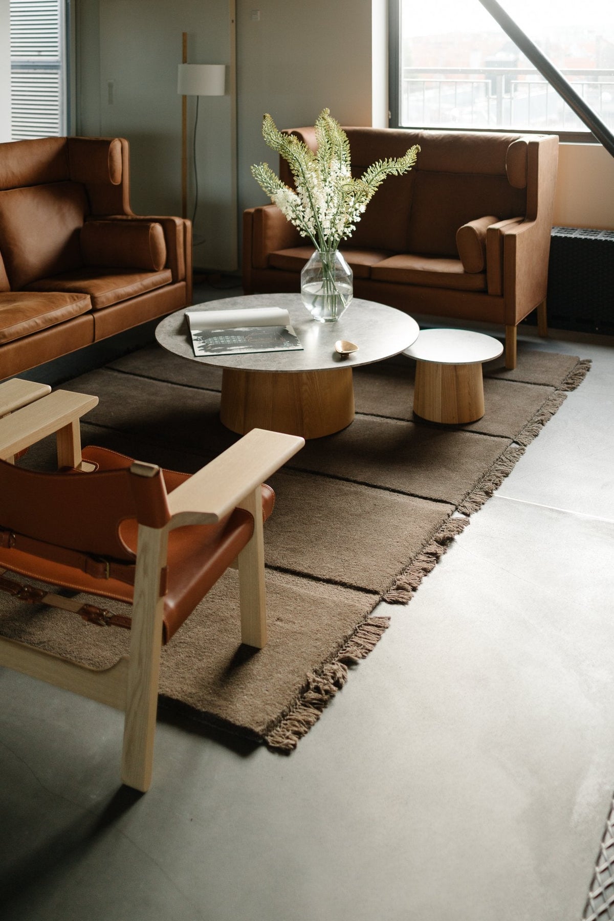 Massimo Atoll Brown hand tufted wool rug, shown in an interior