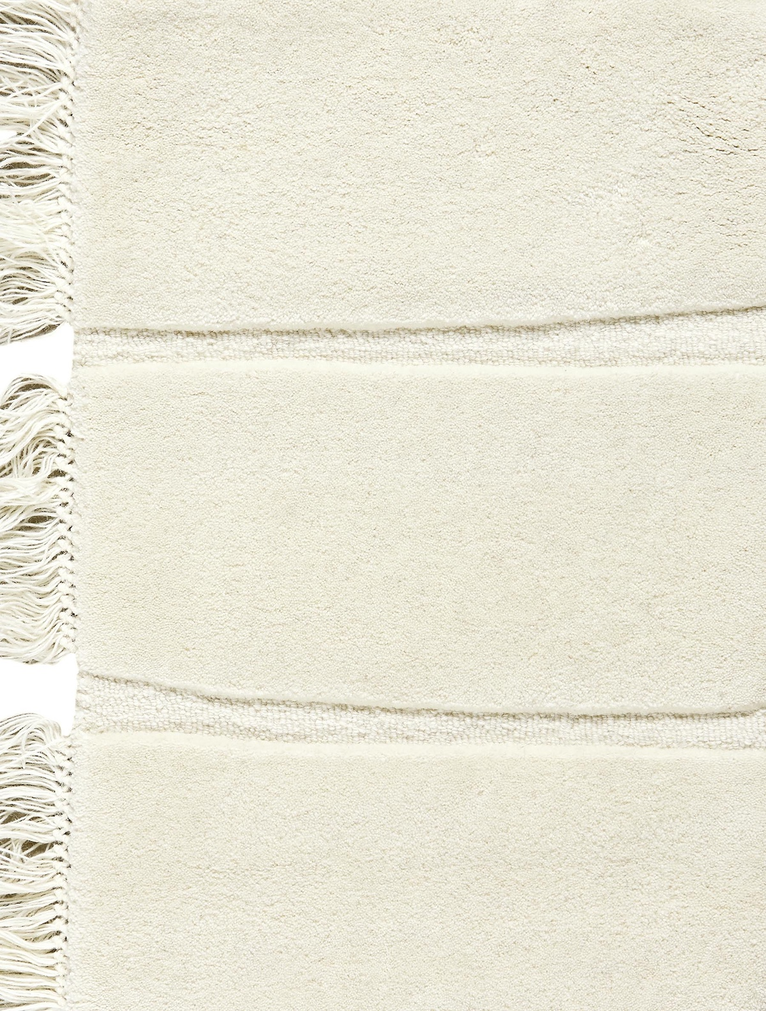 Massimo Atoll Cream hand tufted wool rug, detail of the fringes
