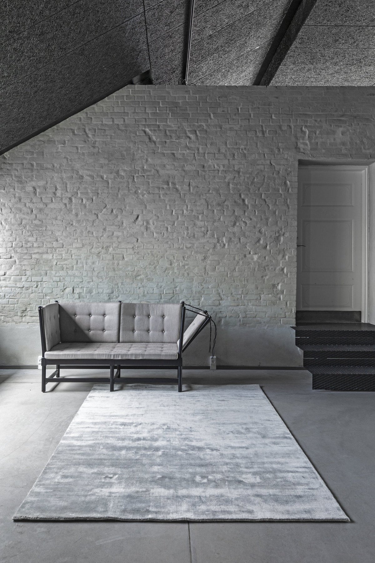 Massimo Earth Bamboo Concrete Grey wool rug, shown in an interior