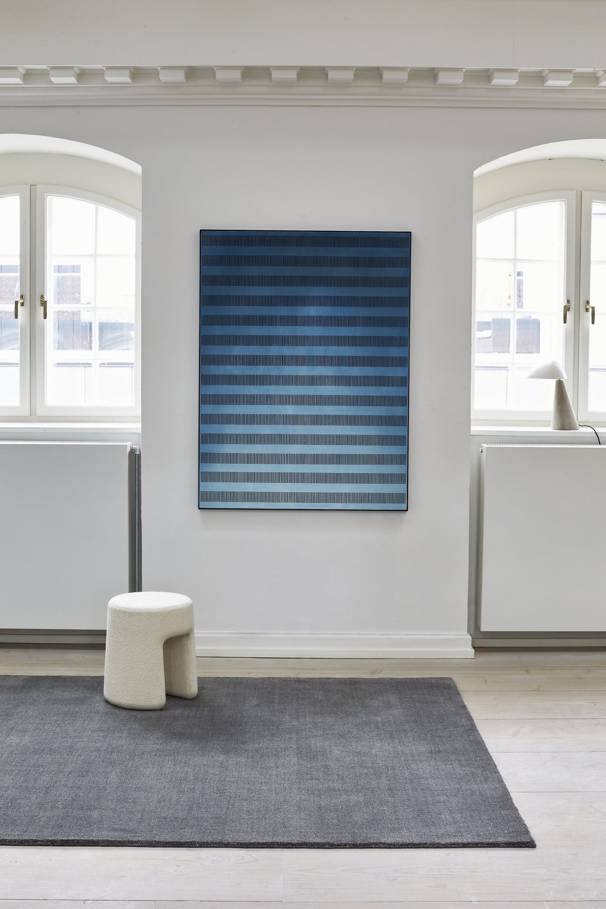 Massimo Earth Natural Dark Grey wool rug, shown in an interior