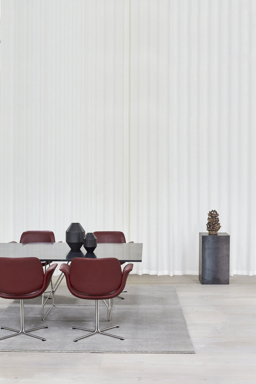 Massimo Earth Natural Light Grey wool rug, shown in an interior