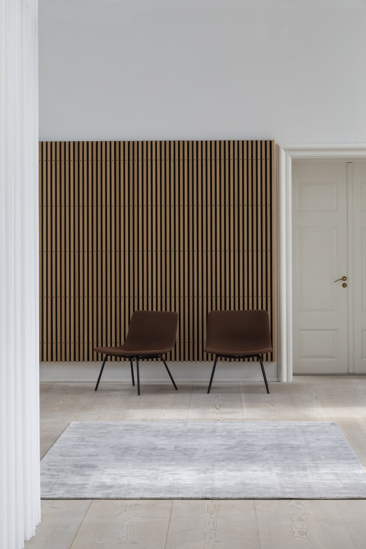Massimo Karma Light Grey bamboo silk rug, shown in an interior