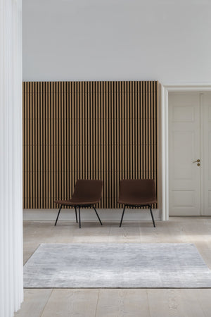 Massimo Karma Light Grey bamboo silk rug, shown in an interior