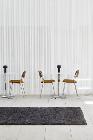 Massimo Rya Charcoal high pile wool rug, shown in an interior