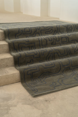 Massimo Structures 2.0 Arctic Green rug, draped over a flight of steps