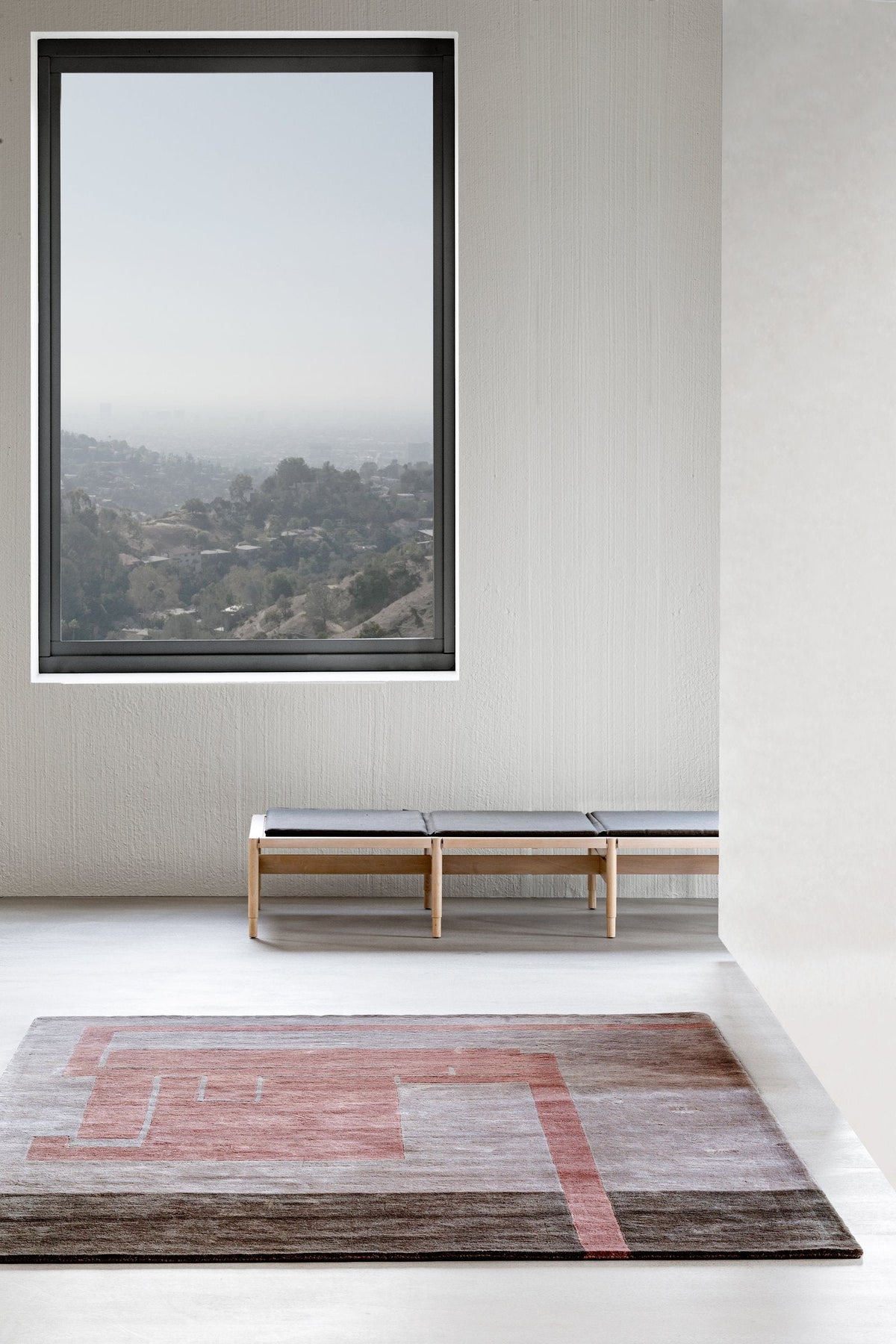 Massimo Structures Fragment 3 pink wool rug, styled in a bright room