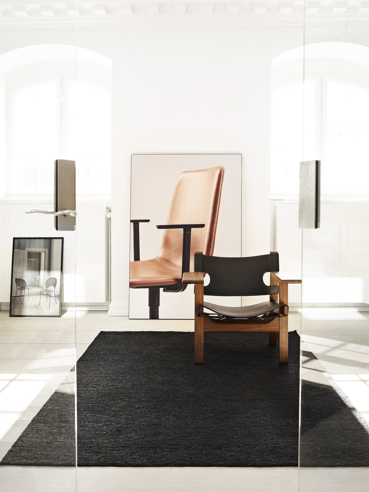 Massimo Sumace Black jute rug with fringes, shown in an interior