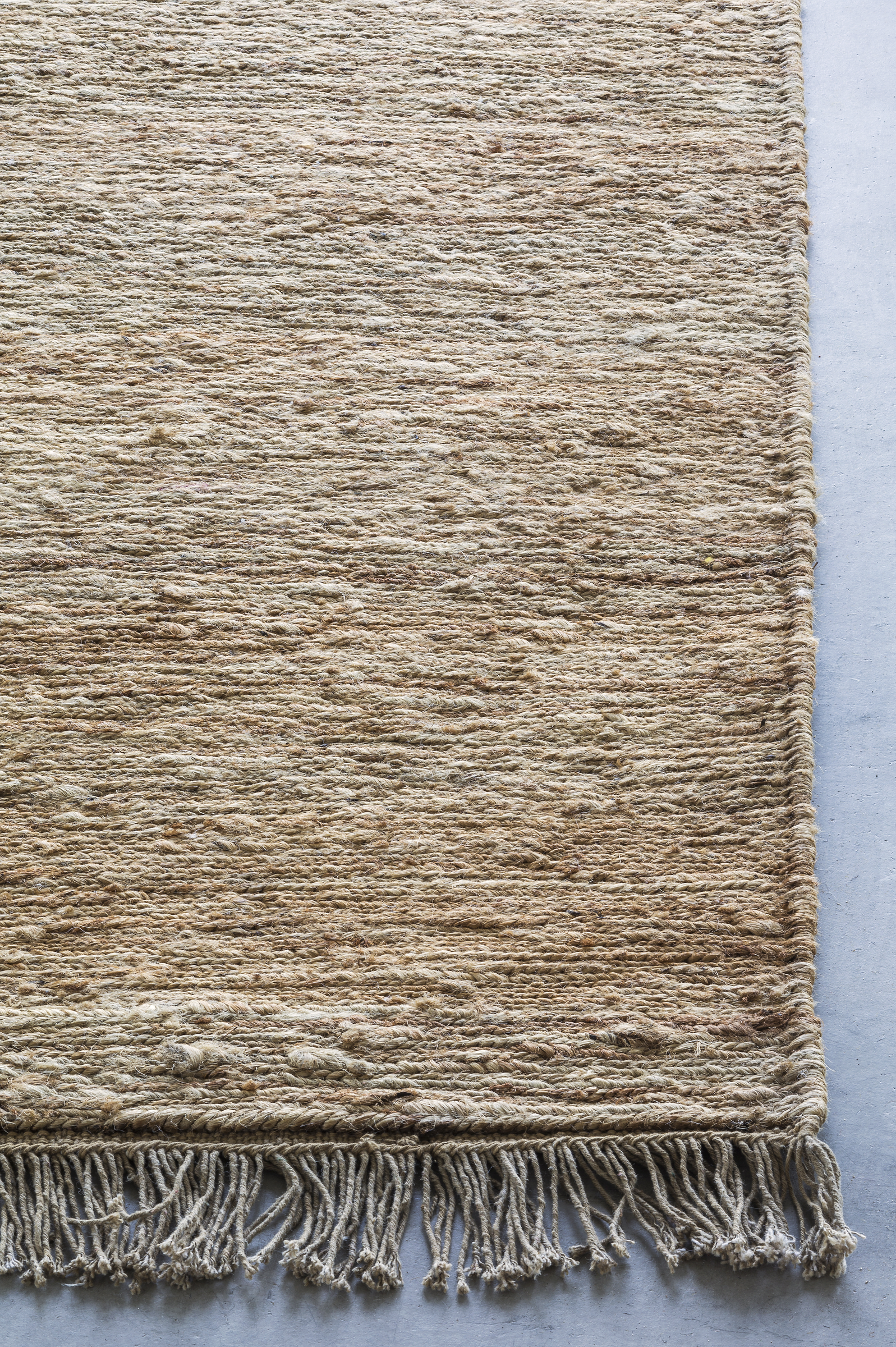 Massimo Sumace Natural fringed jute rug, detail of the corner