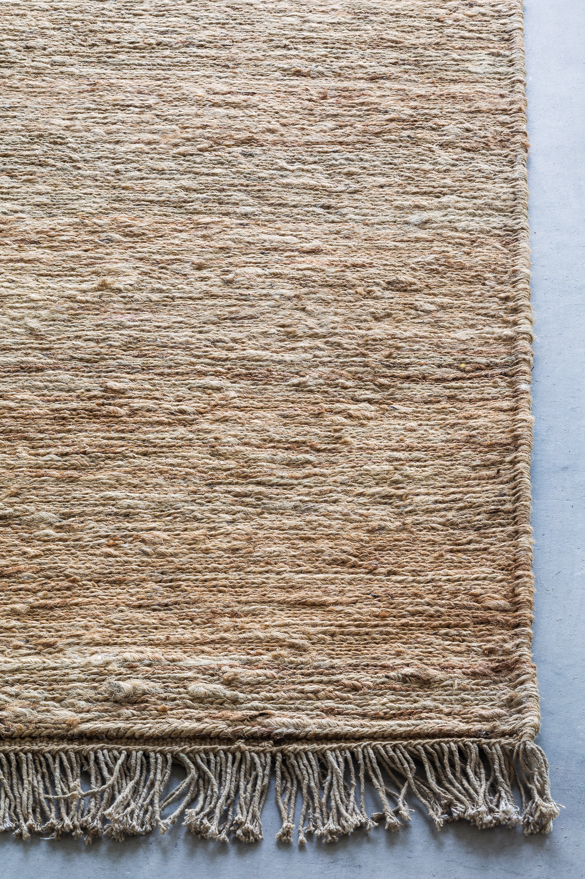 Massimo Sumace Natural fringed jute rug, detail of the corner