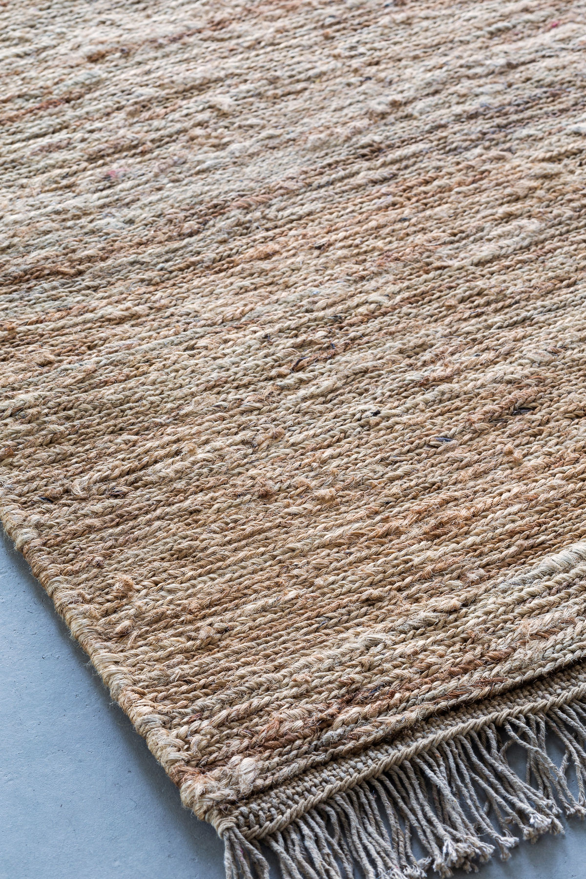 Massimo Sumace Natural fringed jute rug, perspective view